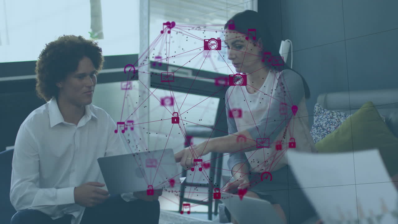 Digital icons and connections animation over business people working on laptops