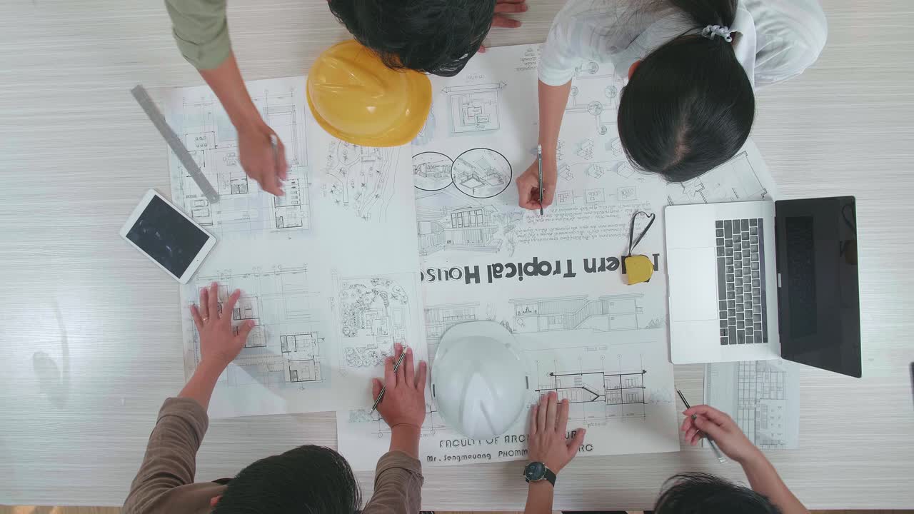 Top View Of Group Asian Engineers Discuss About Work At The Office