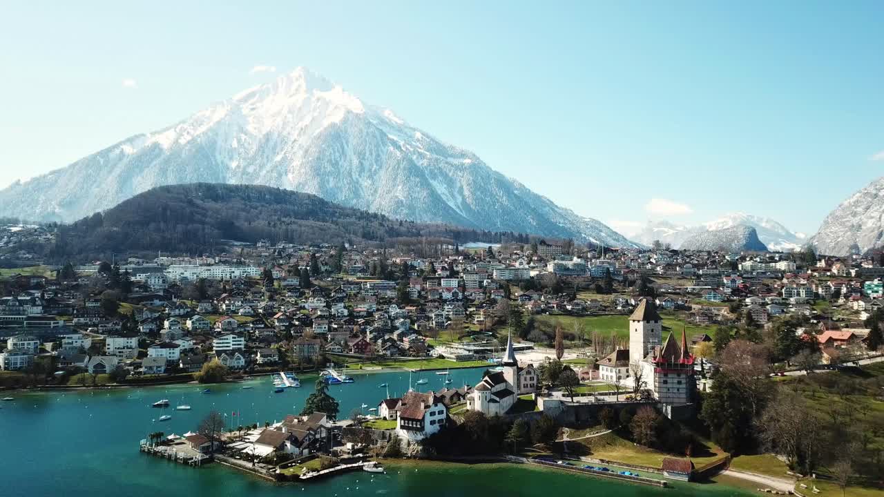 Aerial View of a Castle and Village in the Swiss Alps