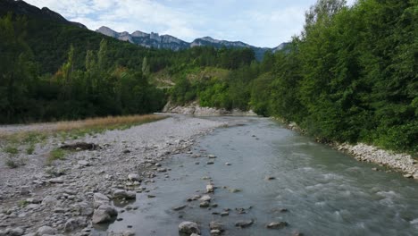 Aerial-low-angle-above-the-river-sunlight-scenery,-overlooking-the-Col-de-Blancheville,-river-Drôme