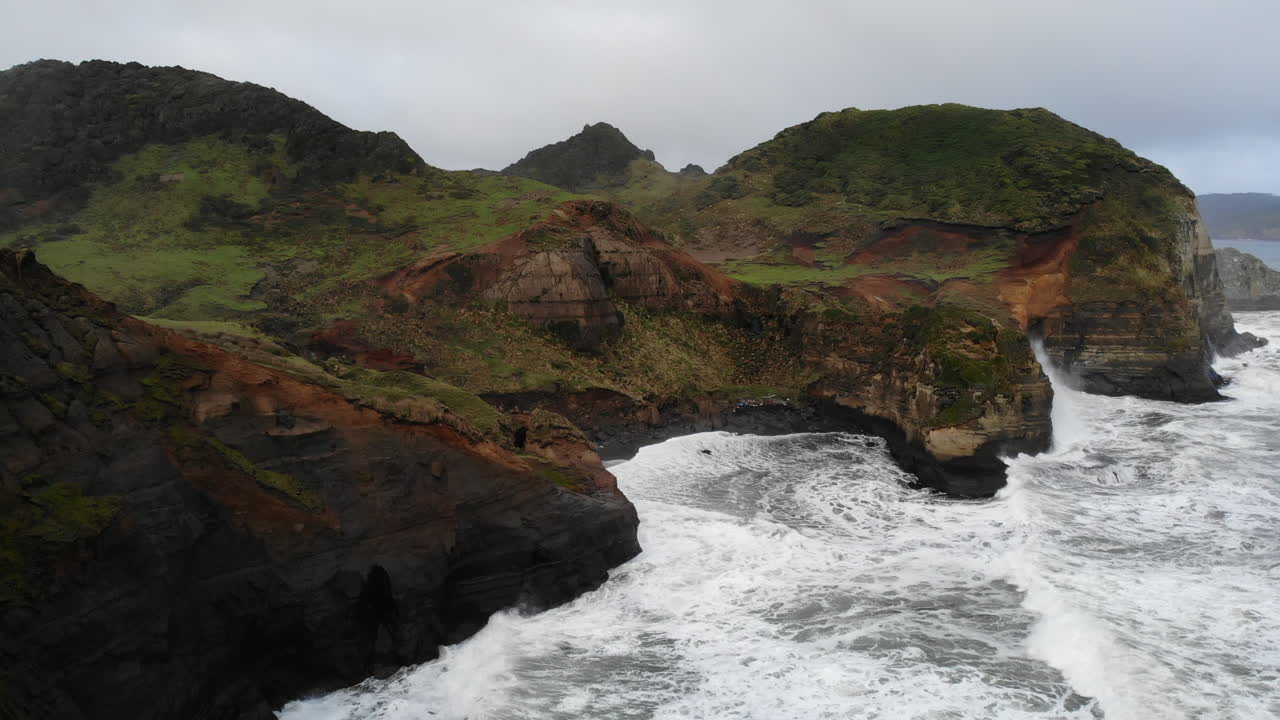 Scenic coastal landscape with cliffs, rocks, and waves