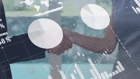 statistical data processing against mid section of businessman and businesswoman shaking hands