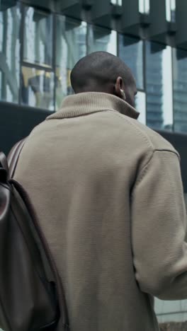 man walking in a city