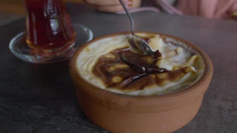 turkish sütlaç dessert with tea