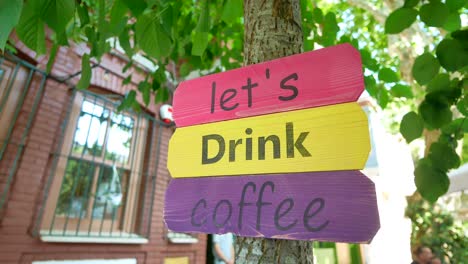 colorful coffee sign in a cozy outdoor cafe