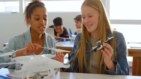 kids discussing over drone model 4k