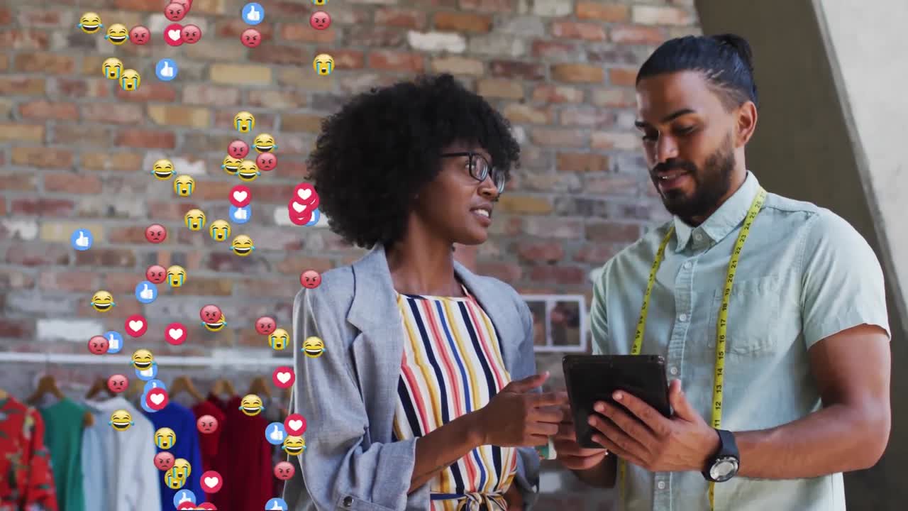 Animation of social media emoji icons over diverse business people