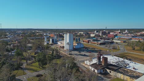 manufacturing plant in daytime in valdosta city, lowndes county, georgia. wide drone shot