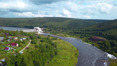 aerial view of a dam and river in a rural landscape