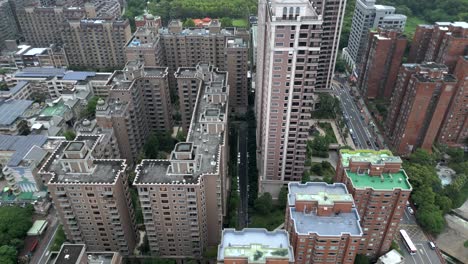 modern aerial view of high-rise buildings, street, and green spaces in luzhu district