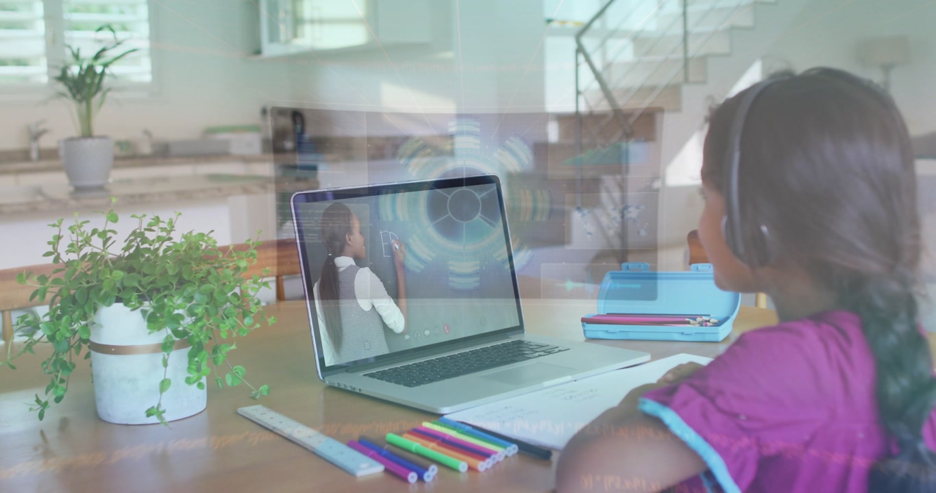 Watching child in purple top headset following laptop teacher writing at home, notebook, copy space