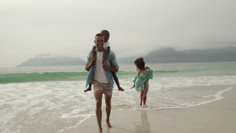family enjoying free time by the sea