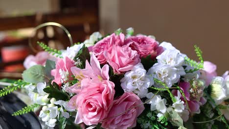wedding bouquet of blossoming pink and white rose flowers, dolly, close up