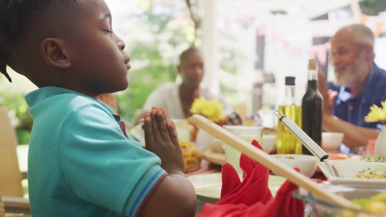 Multi-generation African American family spending time in garden together