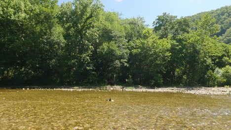 Moment-of-personal-reflection,-tranquil-riverbed