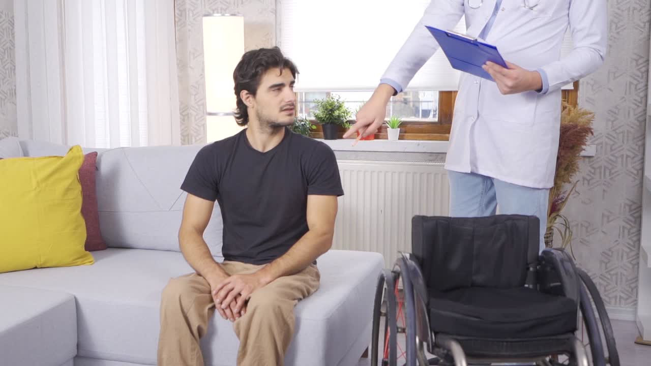 Medical treatment of disabled man in wheelchair. Slow Motion.
