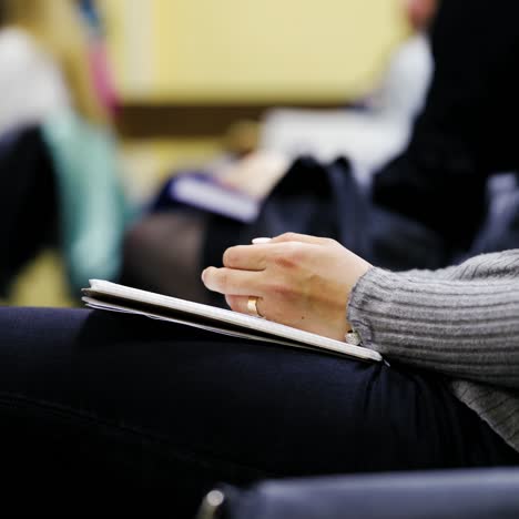 woman holding notepad