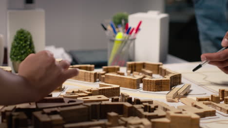 vertical video close up of urban developers showing master plan for residential layout project