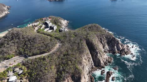 scenic view of cliffs and mountains with luxury residences perched atop in huatulco, oaxaca, mexico