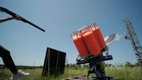 sportsman shoots from a double-barreled shotgun, a sports field for a shooting test is shooting at flying skeet