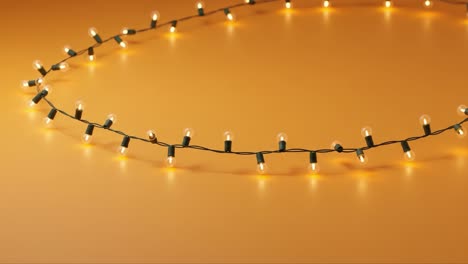 festive string lights on a warm orange background creating a cozy atmosphere perfect for seasonal celebrations and gatherings with family and friends