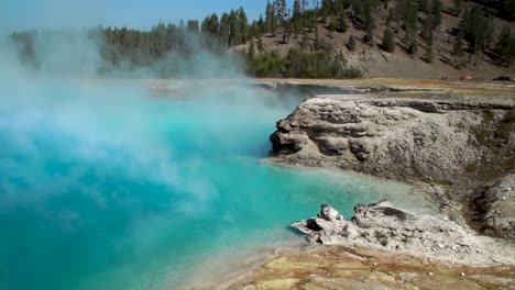 the stunning steamy abyss pool in the prismatic hot springs in yellowstone national park