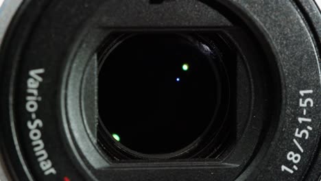 close-up of vintage video-camera. close and open lens zoom of camera. using portable camcorder to shooting videos