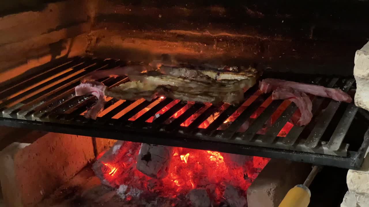 Close shot of meat roasting in a barbacue