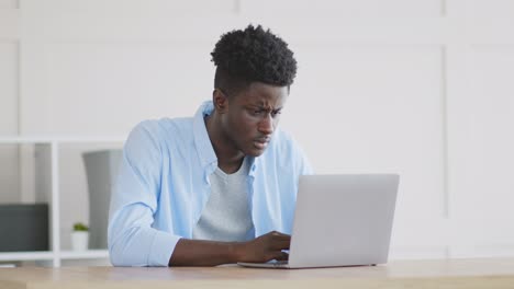 man working on laptop