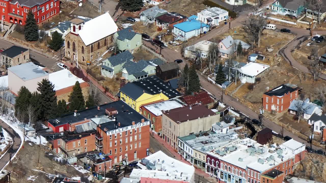 Richest Square Mile on Earth aerial view drone perspective downtown Central City Colorado Opera house gold mining casino town Gilpin county historic buildings businesses home community telephoto zoom