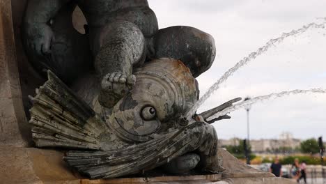 water flows from intricate stone sculpture