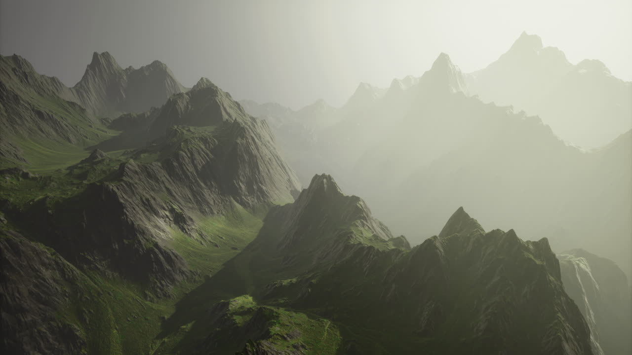 Majestic mountain landscape under a misty sky in a tranquil setting