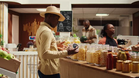 african american buyer visiting local farmers market to shop