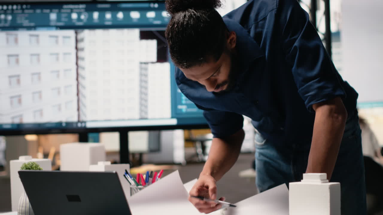 Vertical Video Middle eastern engineer reviewing construction site measurements