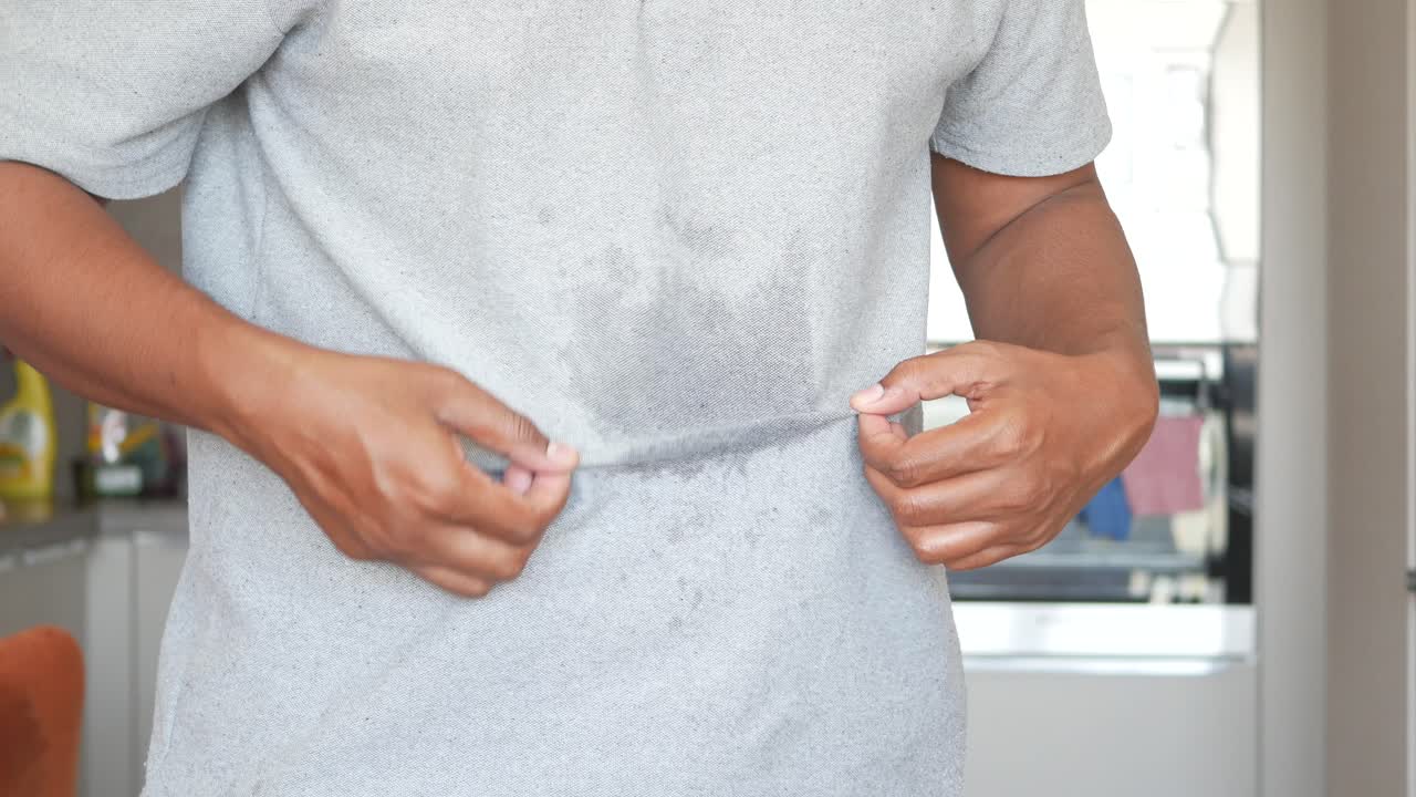 Man Sweating in a Grey Shirt