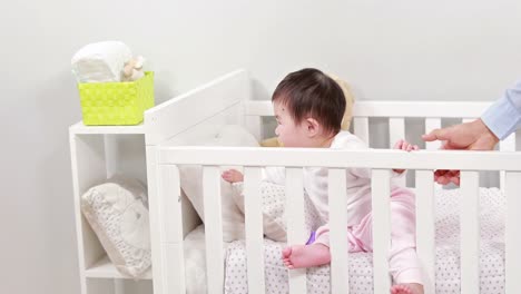 Asian-father-with-his-baby-at-home