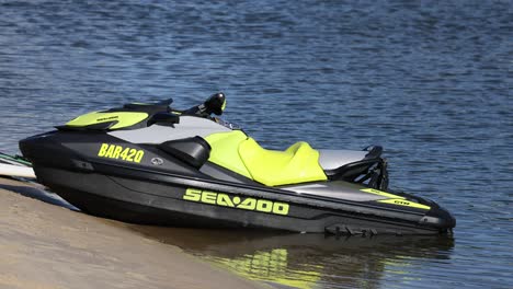 a jet ski moves along the calm lake surface