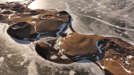 aerial view of snow-dusted pseudocraters and frozen terrain at skútustaðir near lake mývatn. reykjahlíð, iceland