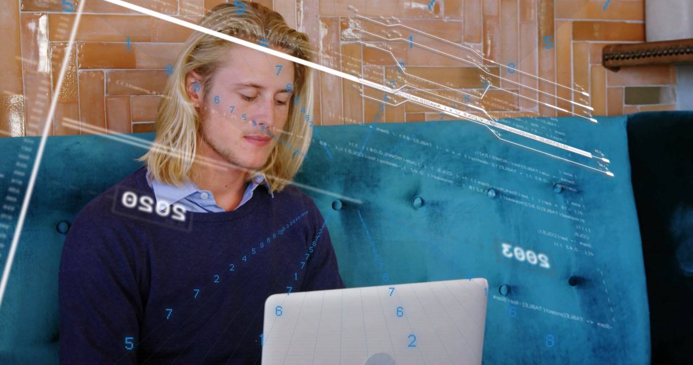 Upon laptop input man sitting using laptop overlays showing years and streaks guiding data analysis