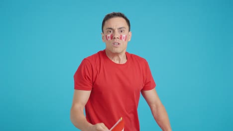 man cheering for canada, angry with the decision of referee