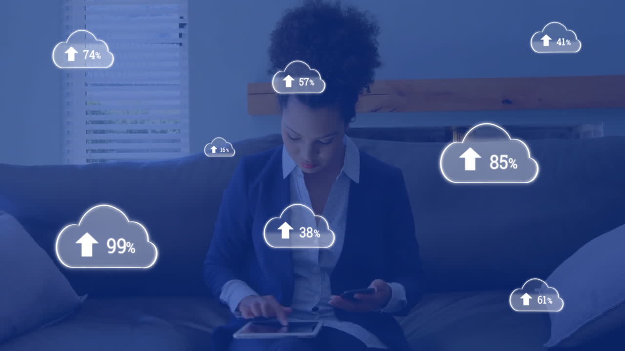Animation of cloud icons with growing number over biracial businesswoman using smartphone