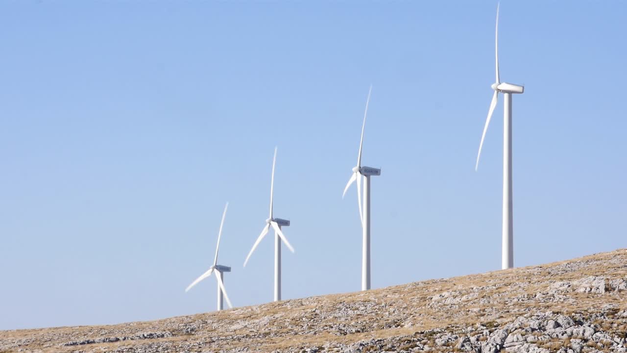 Wind turbines (wind generators) rotating on the crest of the Sierra Gorda de Loja, Granada