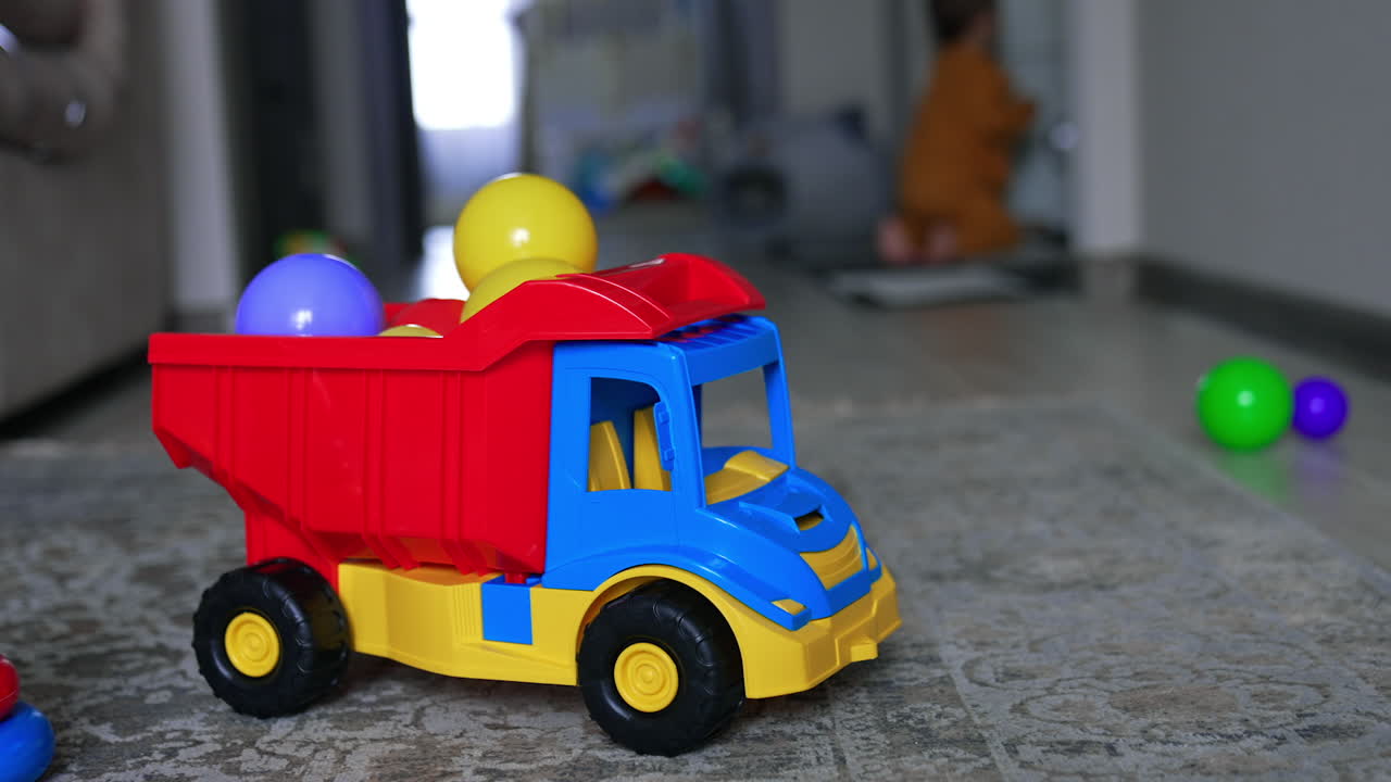 Colorful Toy Truck with Balls in a Playroom