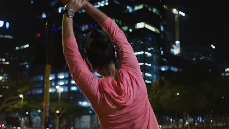 young woman stretching before running