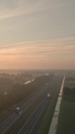 highway sunrise through fog