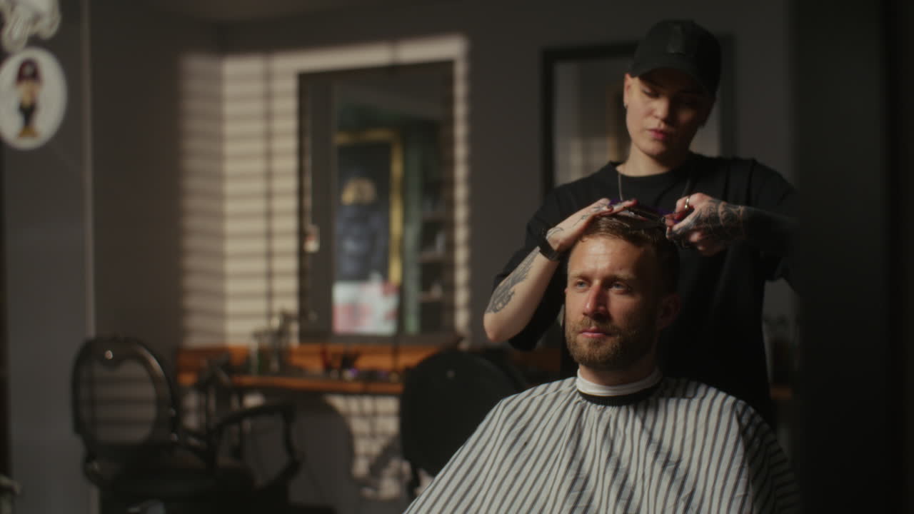 Man getting a haircut at a stylish barber shop