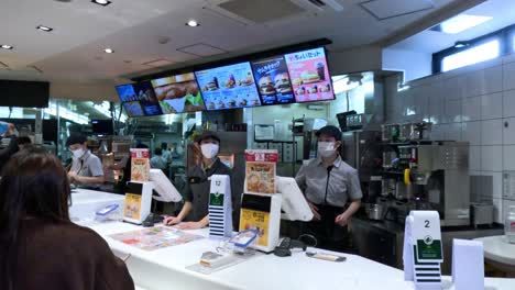 customers ordering food at a fast food counter