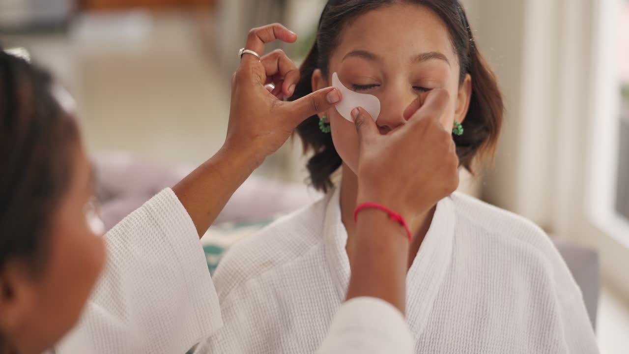 Woman applying eye patch