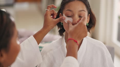 woman applying eye patch