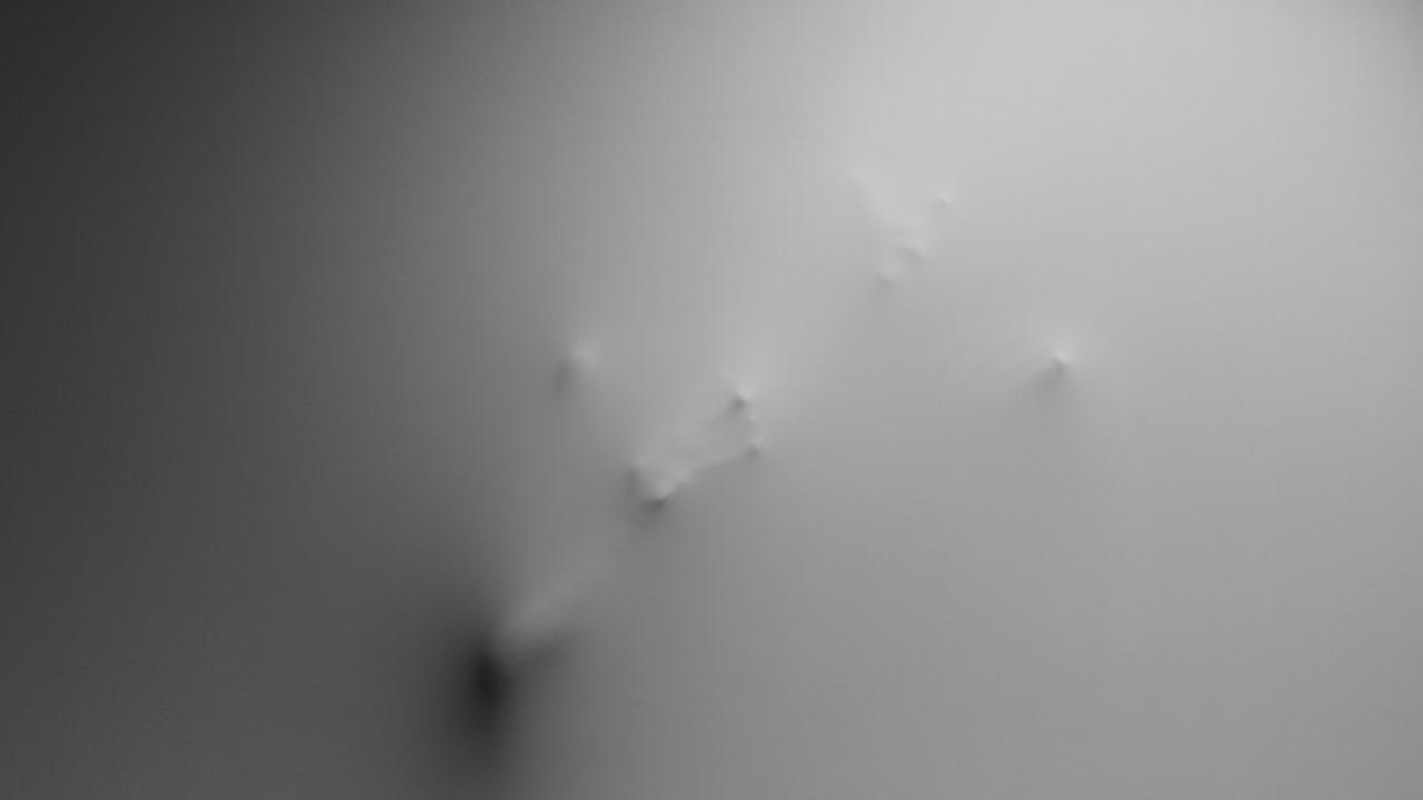 A creepy silhouette of a woman appears from the white surface